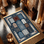 Islamic-style prayer mat with blue center panels, ornate border, and off-white fringe