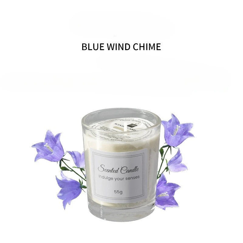 Blue wind chime scented candle in clear glass with purple flowers, 55g label.