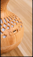 Light wood grain mini vase air humidifier with cutout vents and side control opening