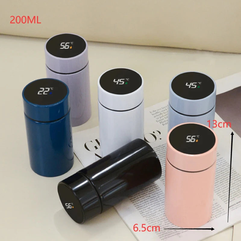 Multiple petite smart thermoses with LED temperature displays in blue, white, purple, and pink