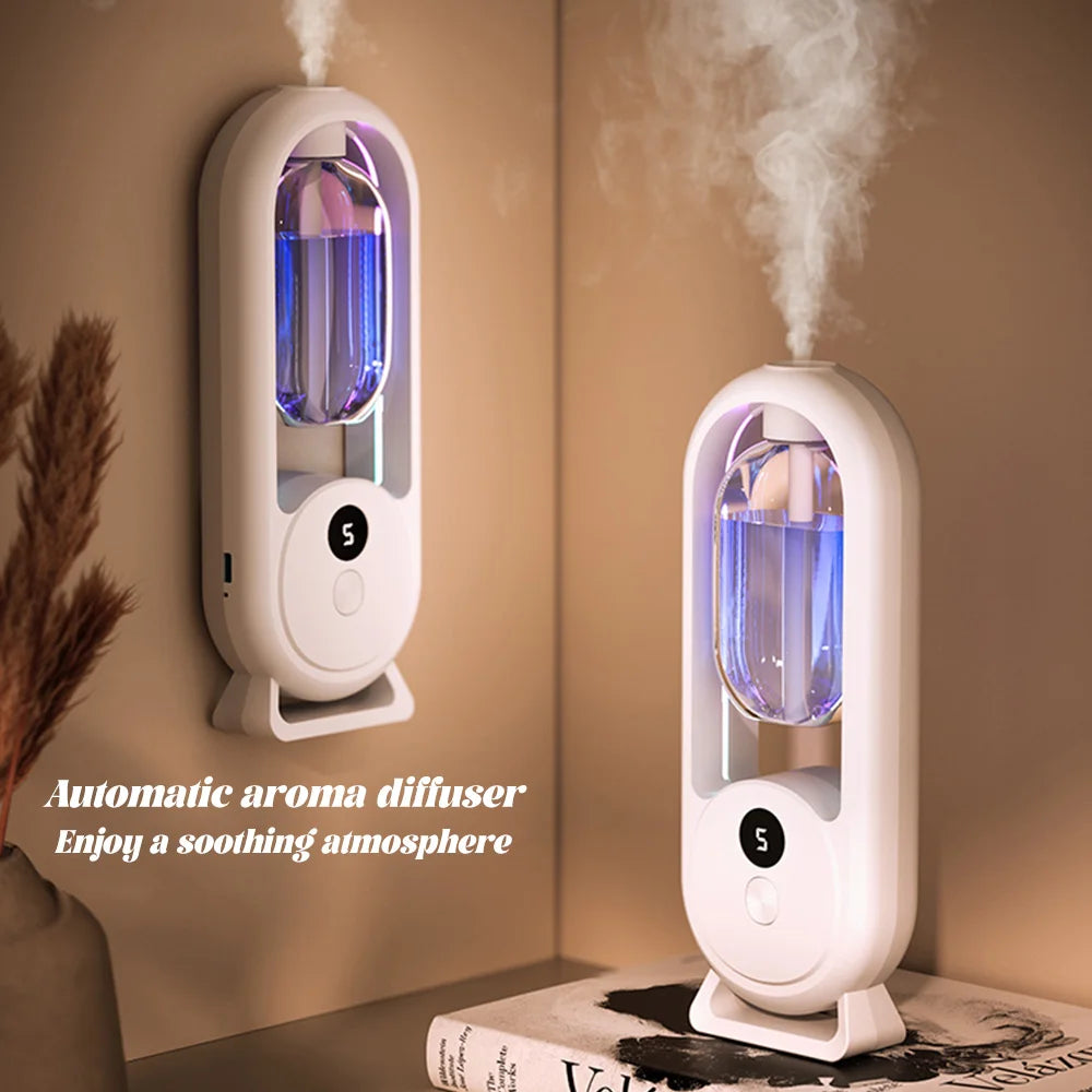 White wall-mounted aroma diffuser with blue glow and visible mist stream