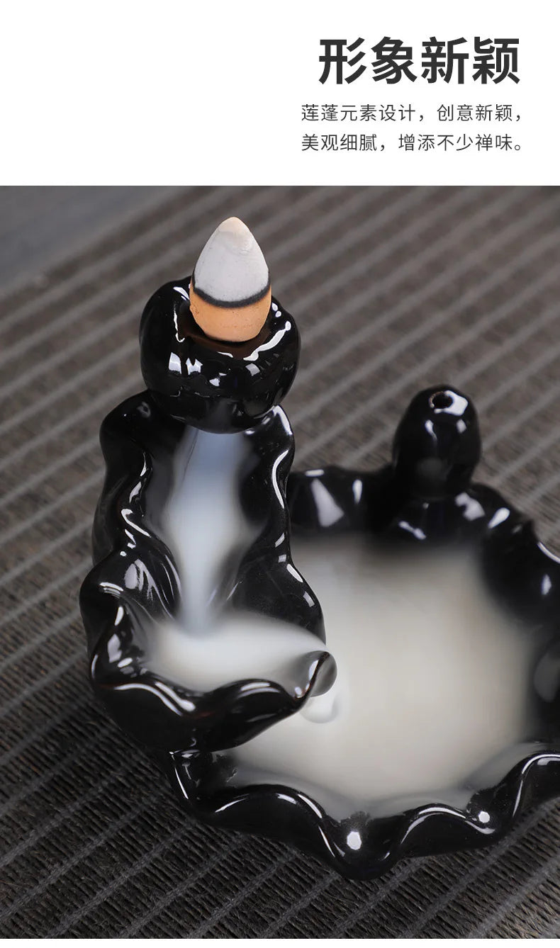 Tower backflow incense burner front view with black glossy figure and cone