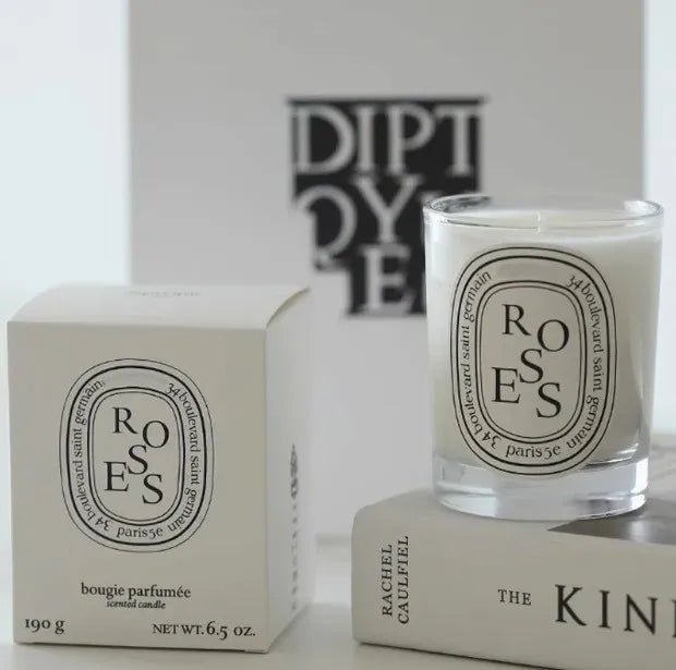 190g scented botanical candle in glass jar with ROSES label and pale wax