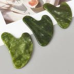 Green jade gua sha heart tools with top notch, polished Xiuyan jade facial massage