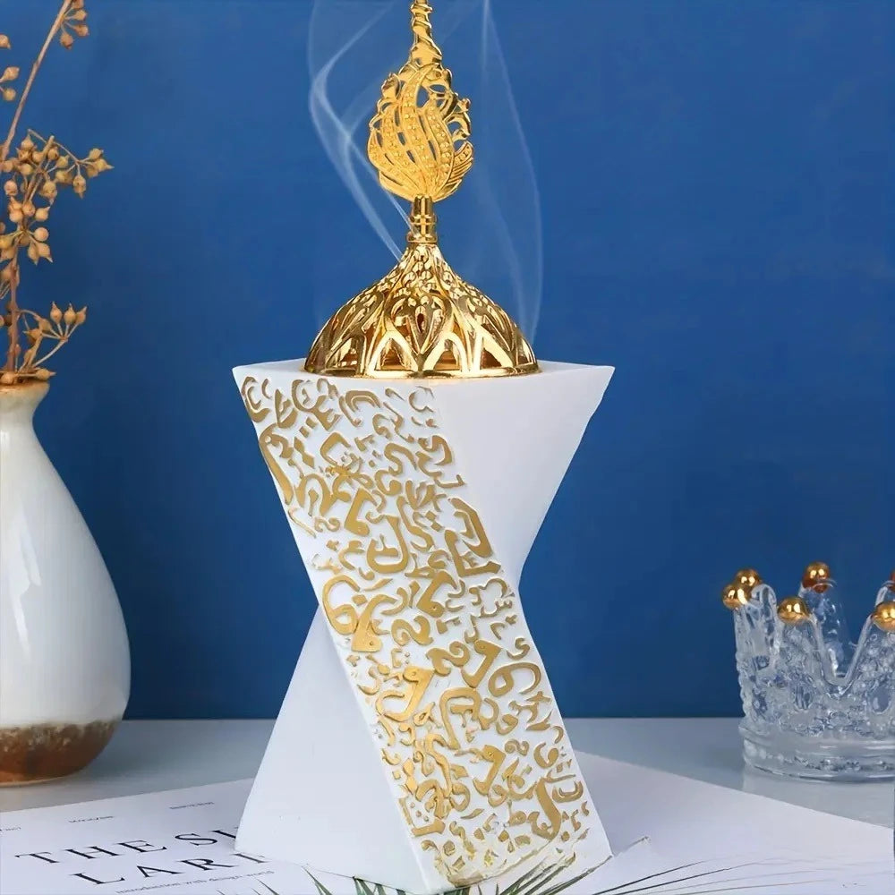 White resin bakhoor burner with gold ornate top and engraved Arabic pattern