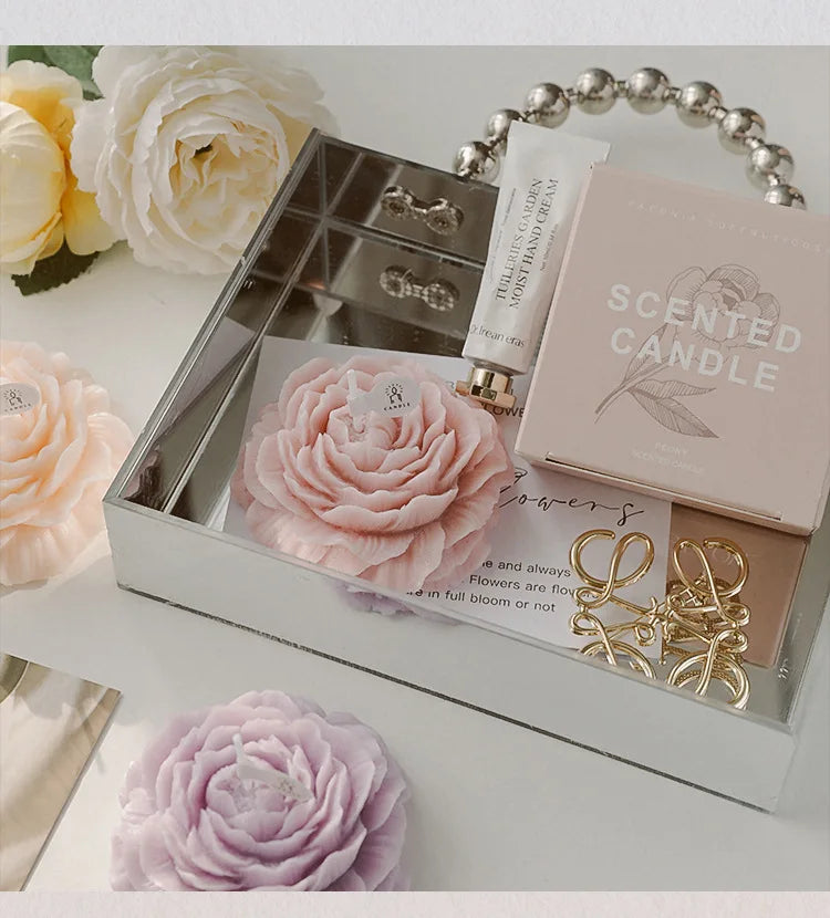 Pink peony sculptural candle in open gift box with rose-style petals
