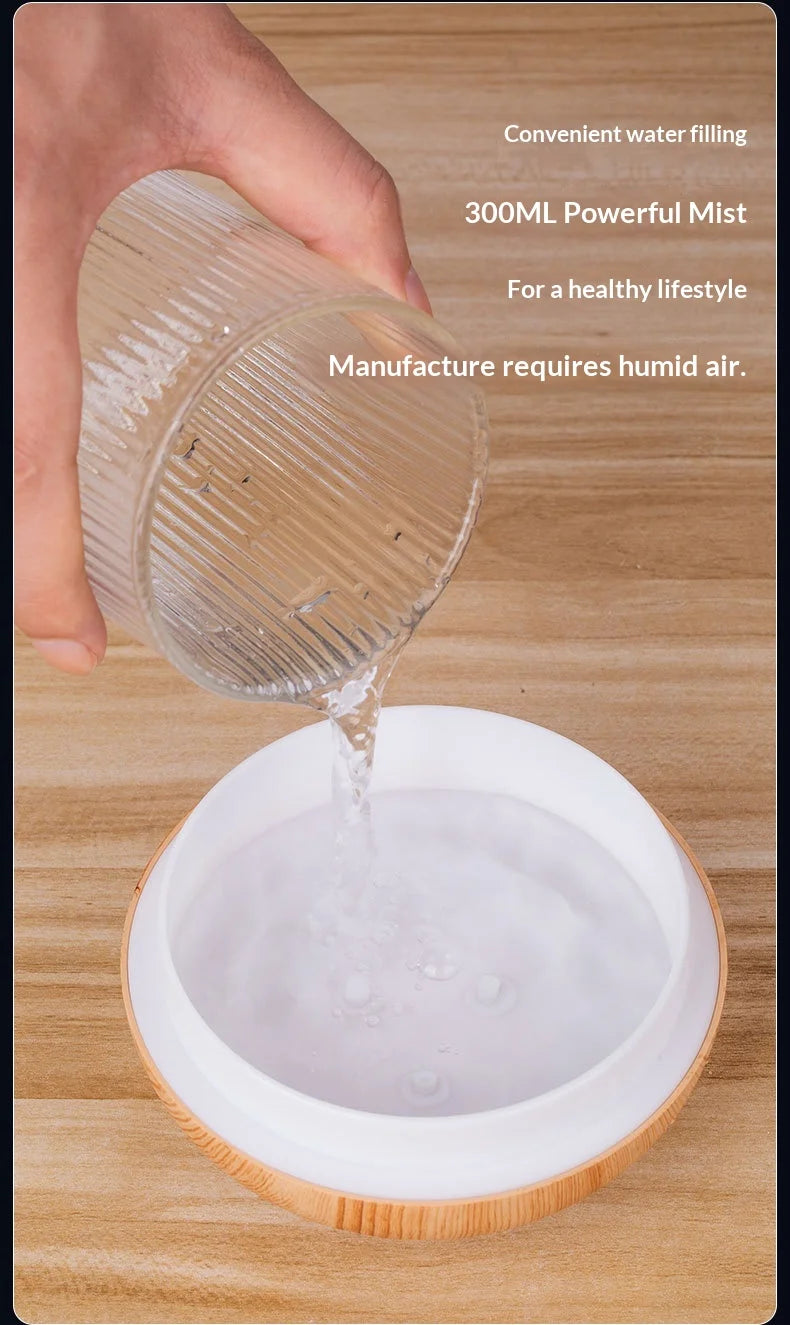 Mini vase humidifier with water poured into a white reservoir bowl