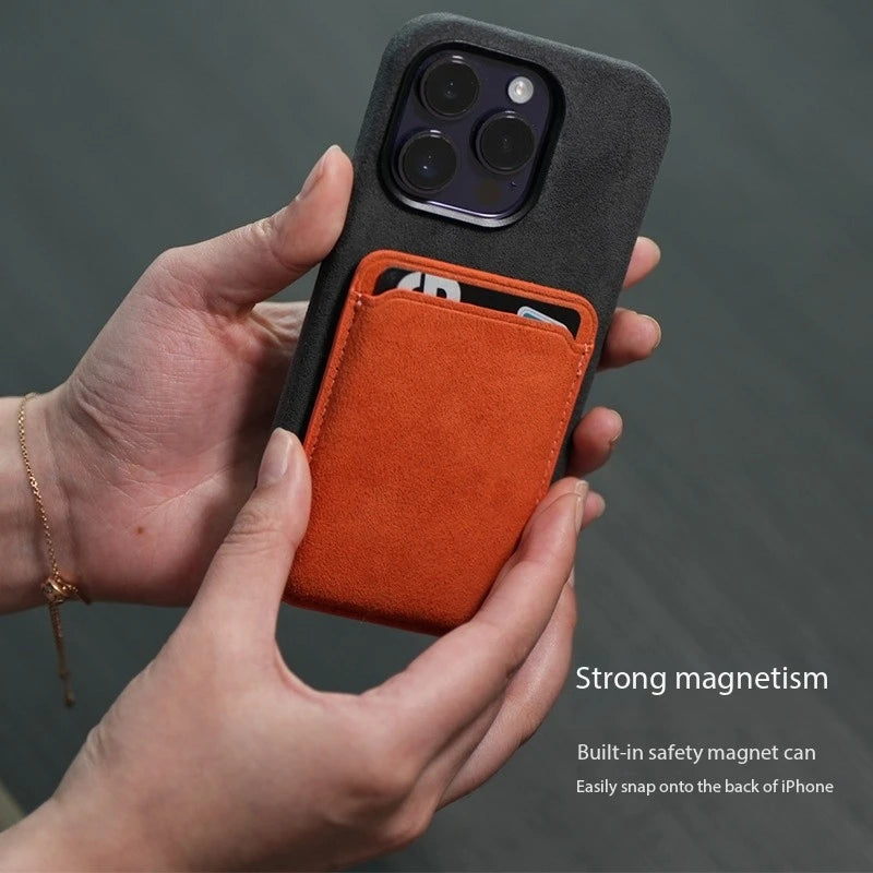 Alcantara MagSafe wallet card holder on phone, orange front card slot, dark backing