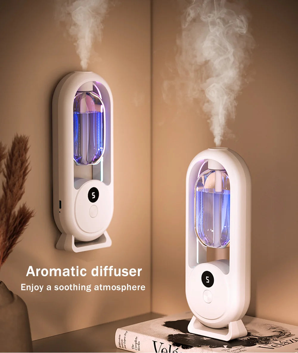 White wall-mounted aroma diffuser with blue-lit chamber and mist rising