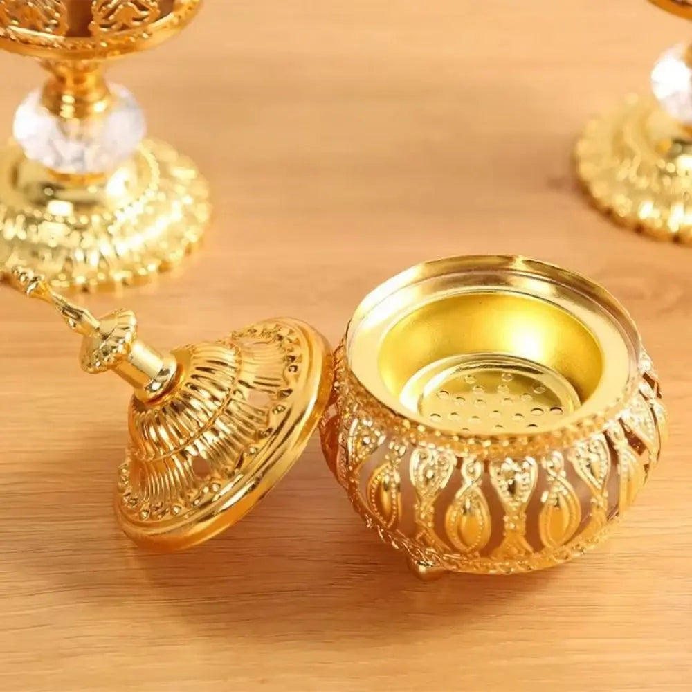 Close-up of gold incense holder bowl and removable burner insert