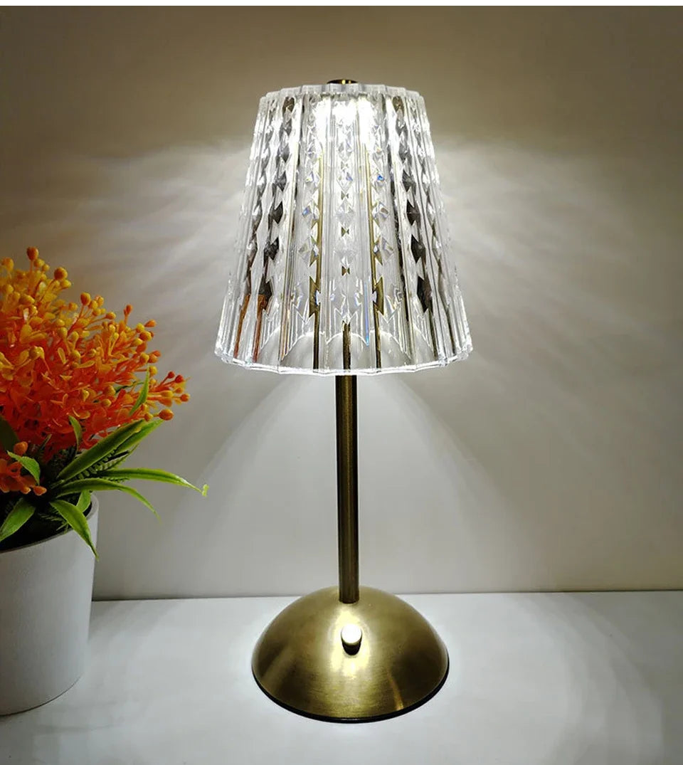 Cordless night lamp with clear crystal-style shade and gold round base