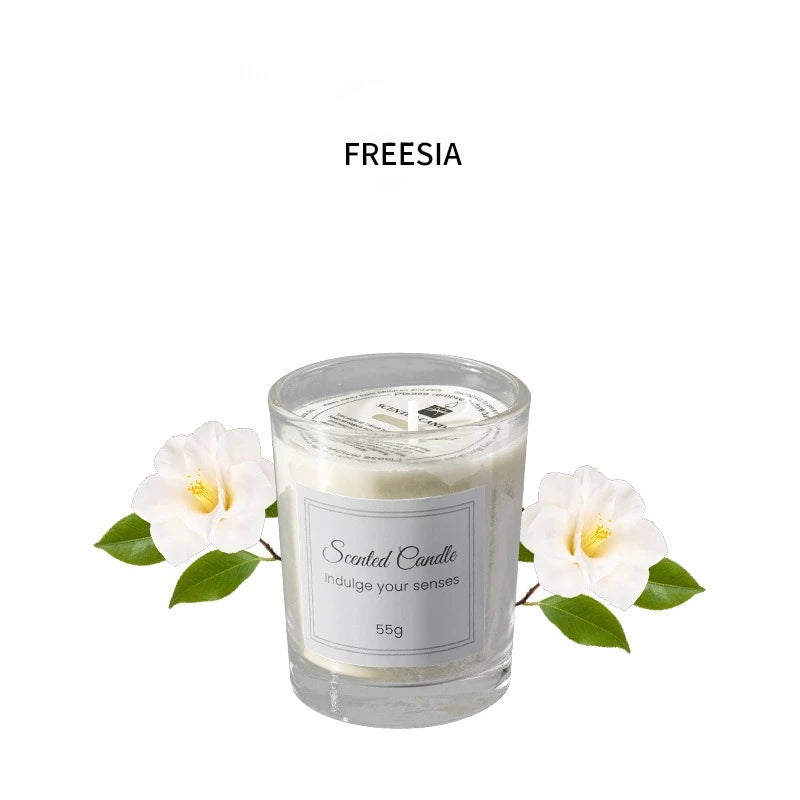 Freesia scented candle in clear glass with white flowers, 55g label.