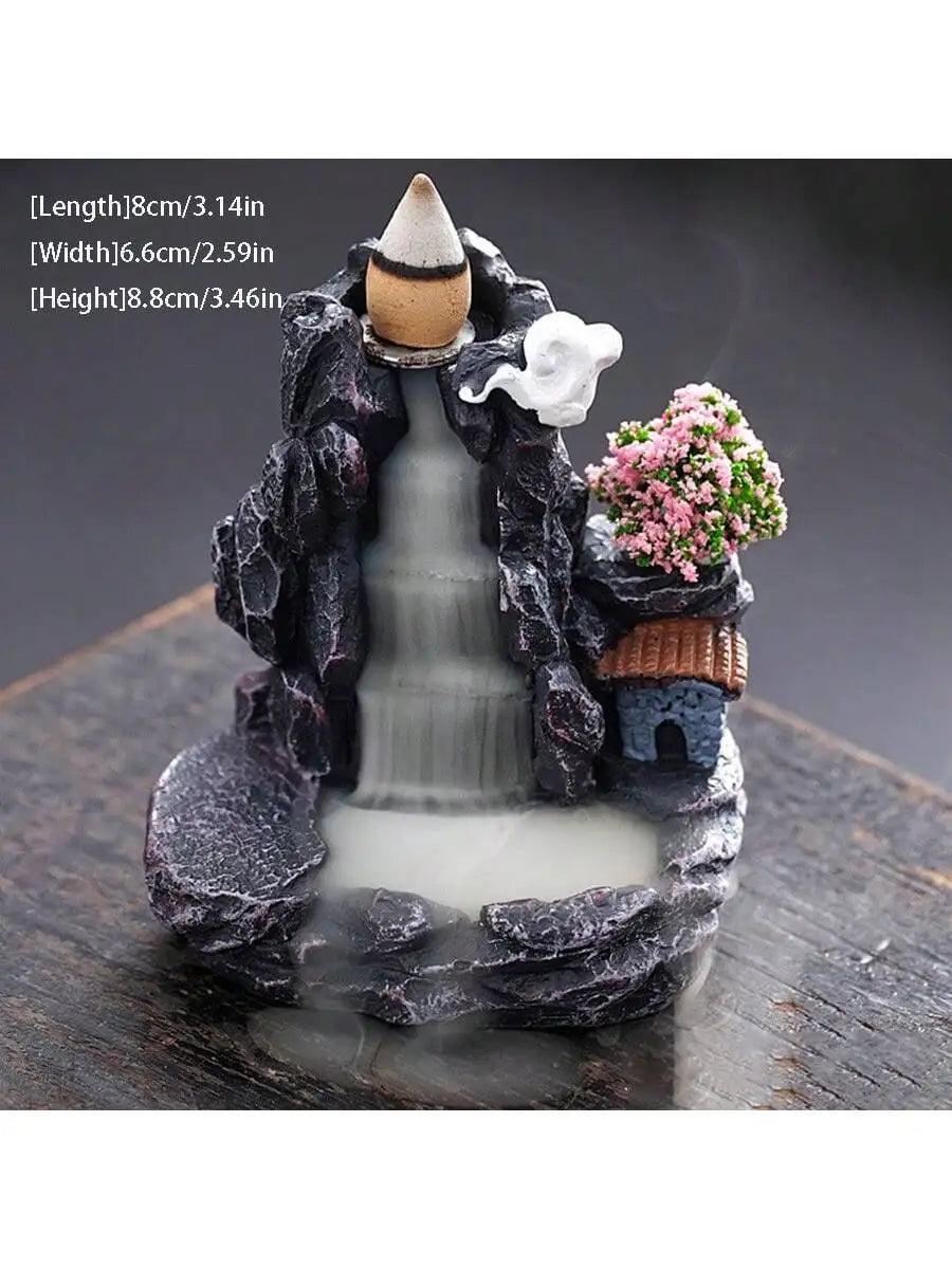 Backflow waterfall incense holder with incense cone, pink flowers, and side water stream