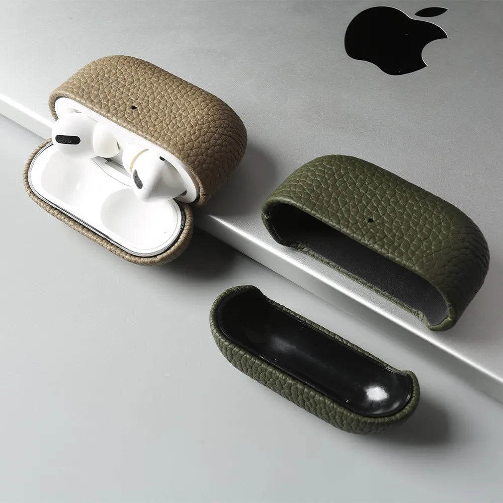 Leather AirPods cases, tan and olive green, plus black case—snap-close textured shells