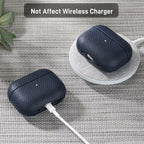 Dark blue leather AirPods Pro case on a charging pad with earbuds inside