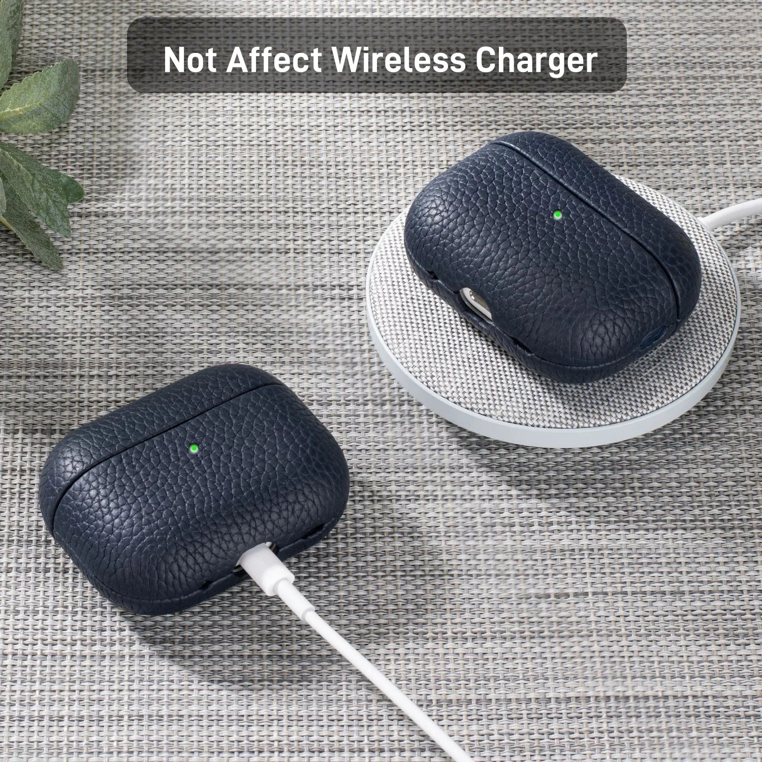 Dark blue leather AirPods Pro case on a charging pad with earbuds inside
