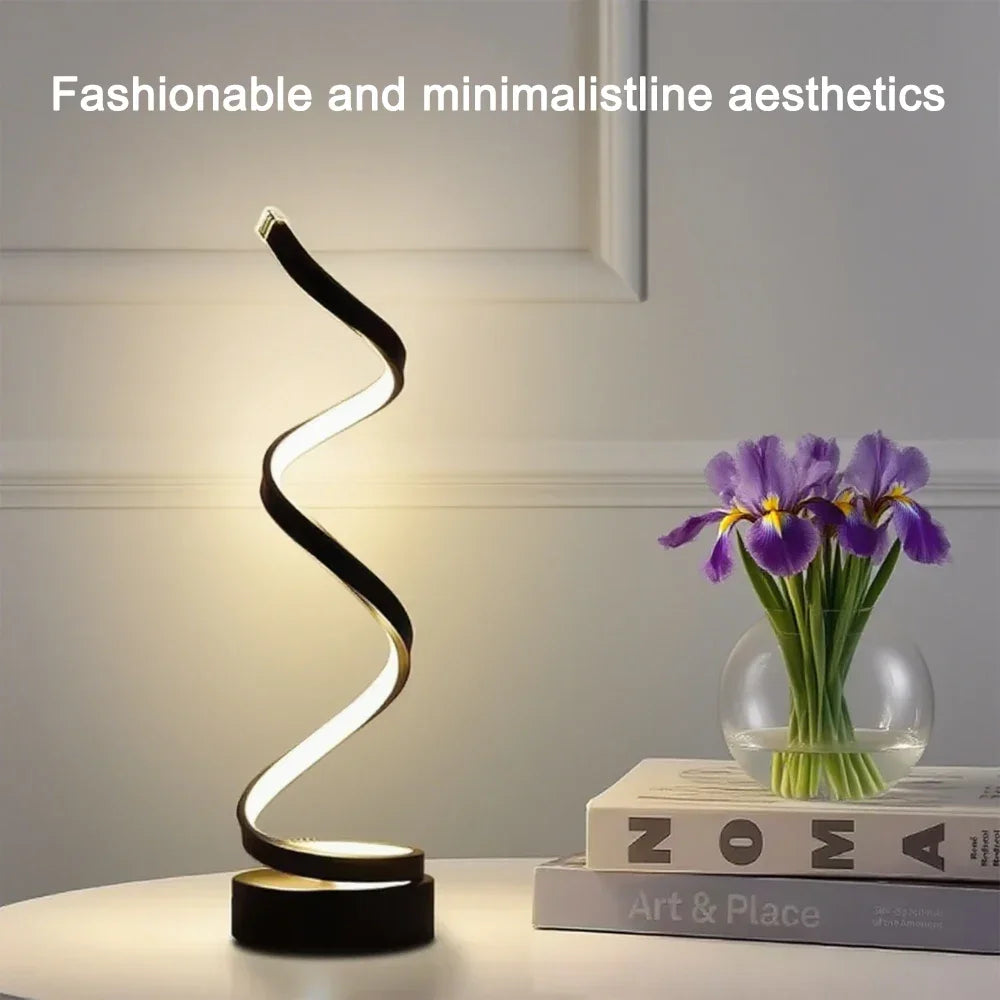 Spiral dimmable LED bedside lamp, black wavy light head on round black base
