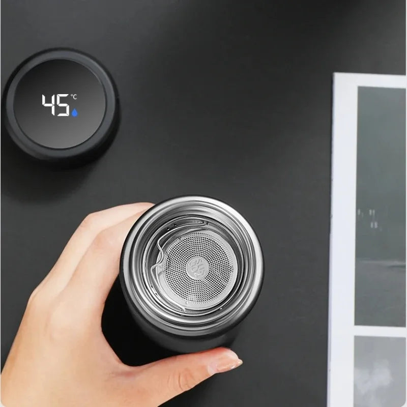 Black insulated thermos with open stainless lid and digital temperature display