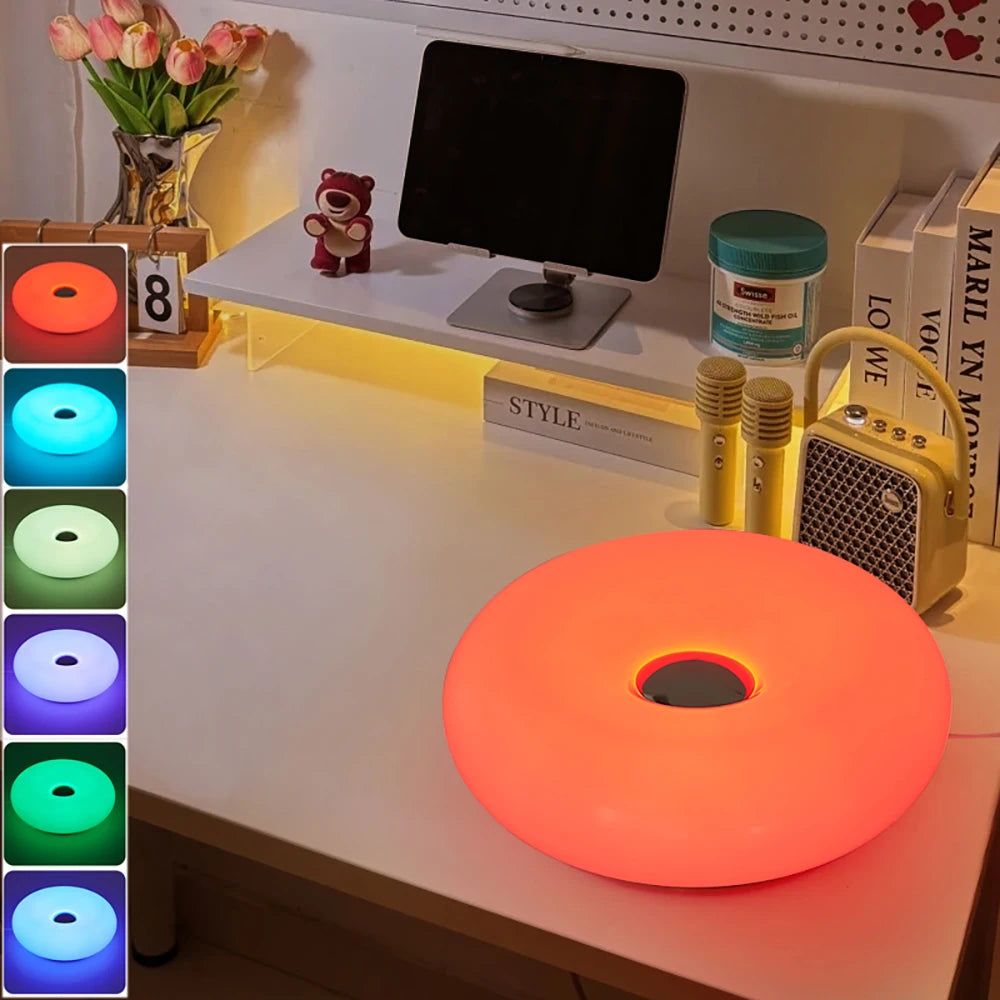 Orange glowing donut table lamp, round profile with center opening