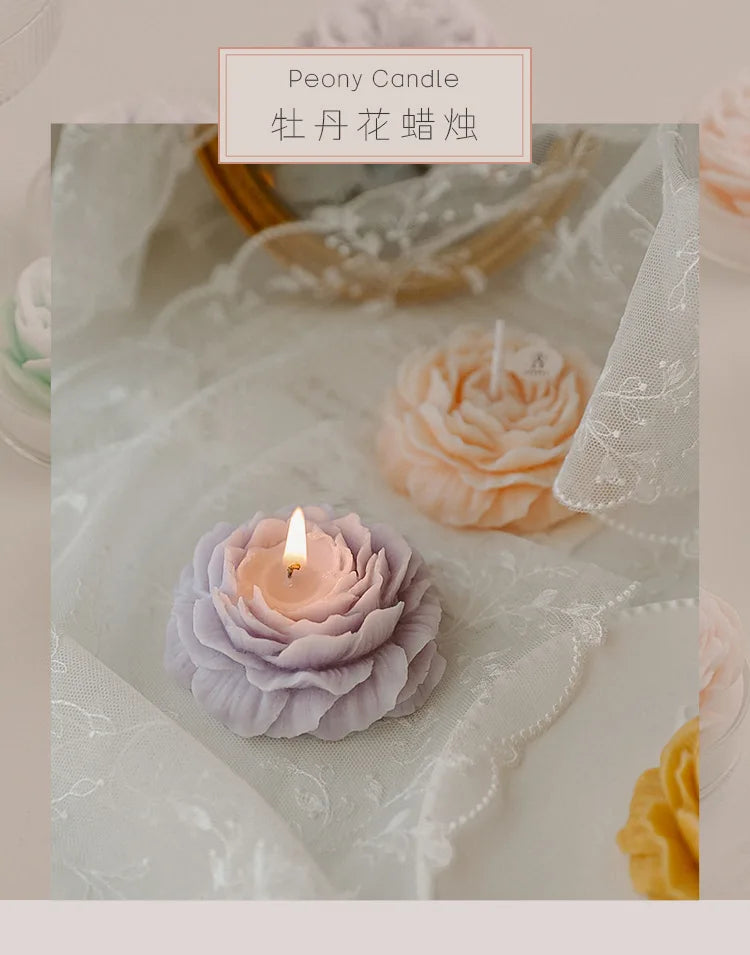 Lavender sculptural peony candle with lit wick, flower-shaped top