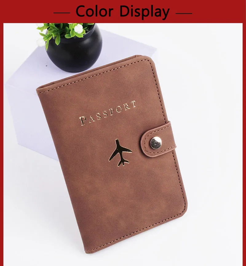 Cognac brown passport folio with airplane logo and side snap closure, faux leather look