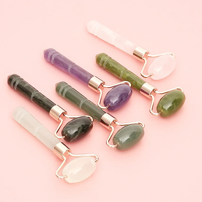 Set of jade roller massagers with rose-gold U-frames in celadon, amethyst, and rose quartz