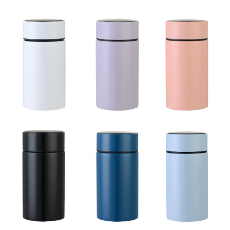 Petite smart thermos in assorted colors, smooth cylindrical body with black rim lid