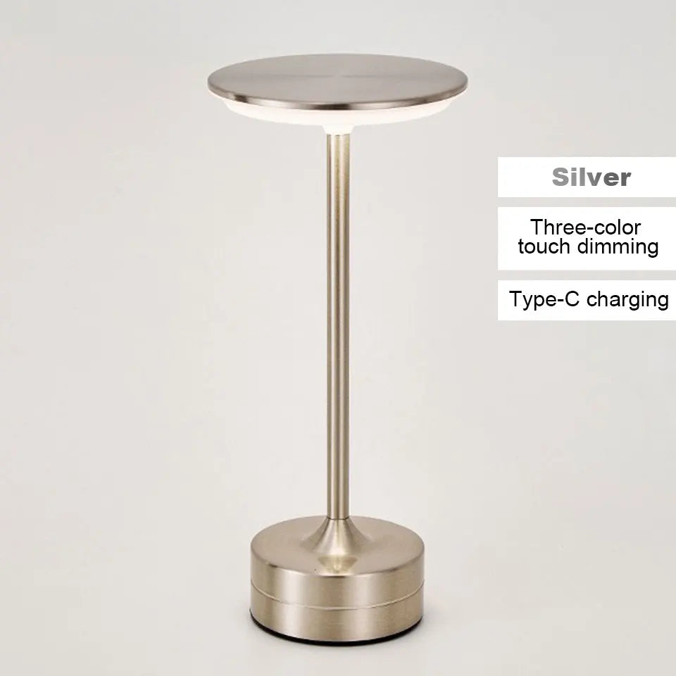 Silver cordless reading lamp with round top, tall stem, and cylindrical base