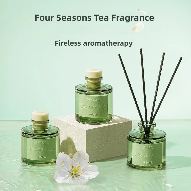 Reed diffuser set with four 50ml bottles and rattan reeds, tea fragrance theme
