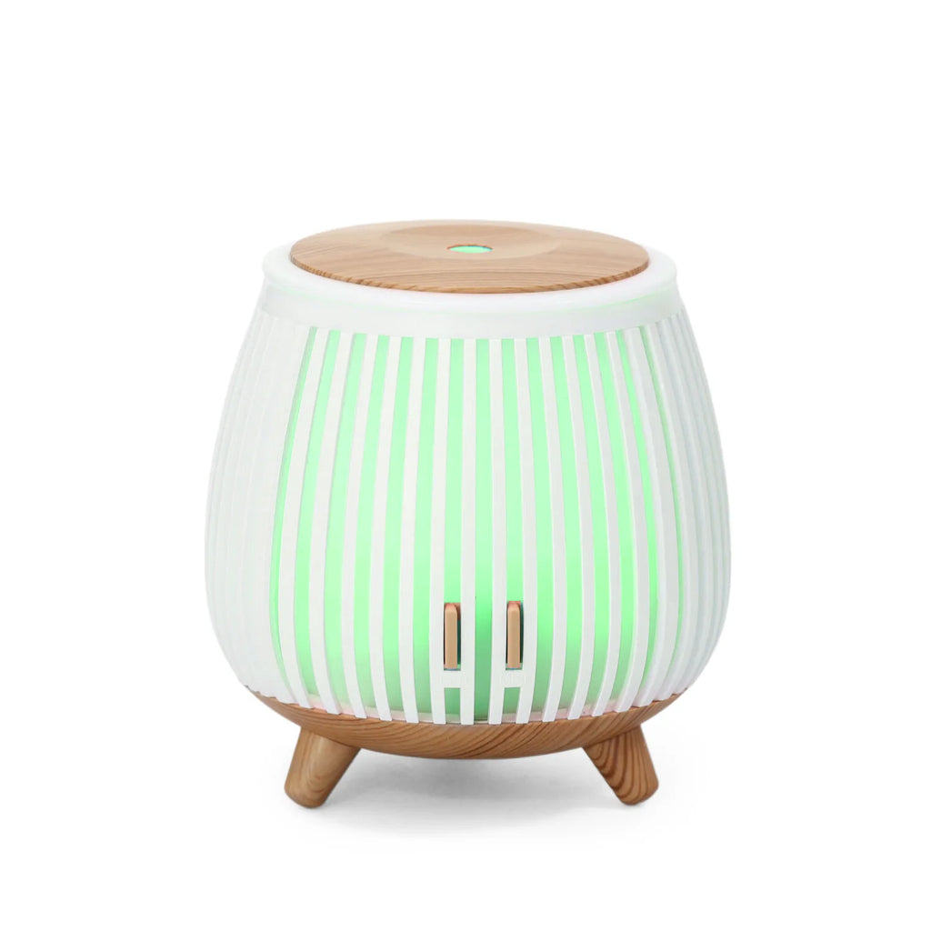 White striped aroma diffuser humidifier with green LED glow and wood top