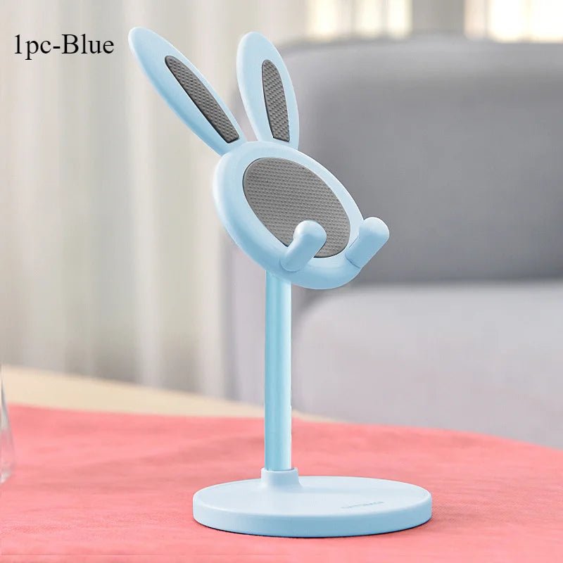 Light blue rabbit phone stand with circular mesh face, upright ears, and round base