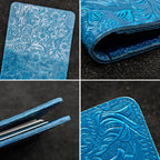 Blue embossed leather edge and stitching detail on travel folio