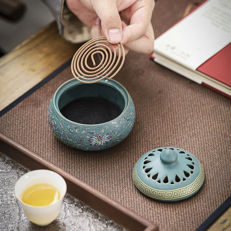 Sky blue enamel lotus incense burner with perforated lid and floral enamel pattern