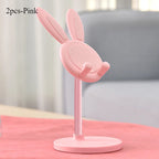 Blush pink rabbit phone stand with mesh ear panels, curved hands, and round base