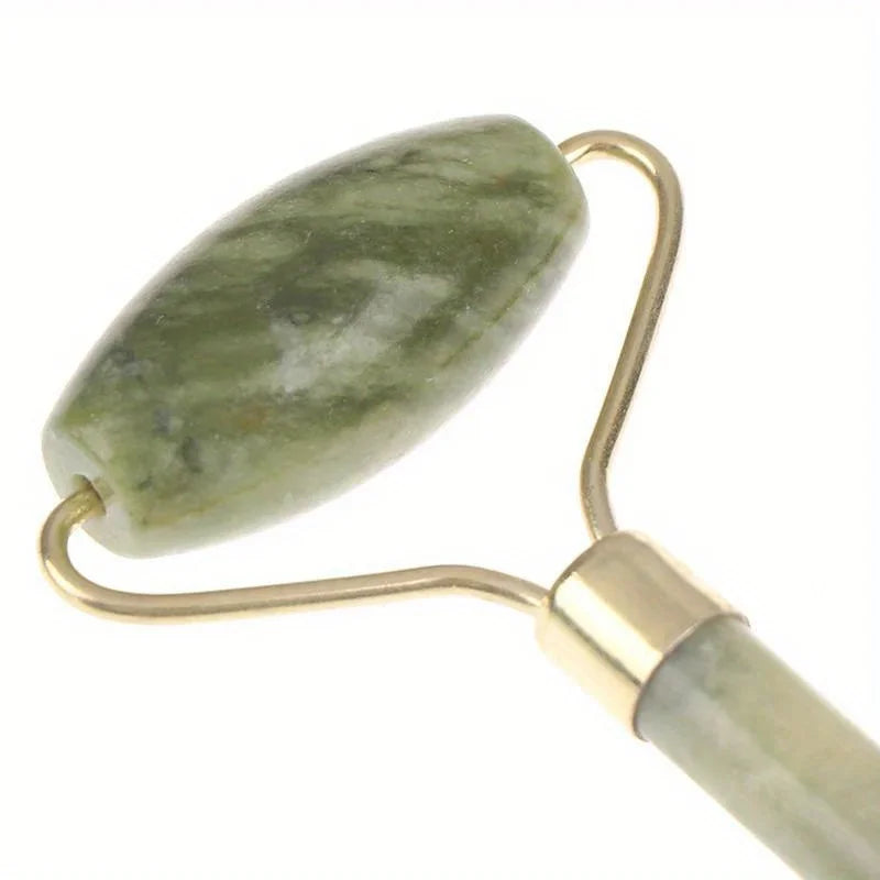 Classic Jade gua sha board close-up of left oval stone and gold crossbar