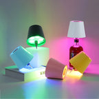 Black and white LED bottle lamps with RGB lighting effects on the bottle