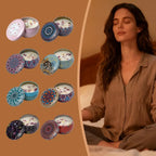 Array of vintage jar scented candles with patterned lids beside a person meditating
