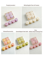 Rose candle gift box set variants showing pastel colors: purple, white, yellow, green, pink