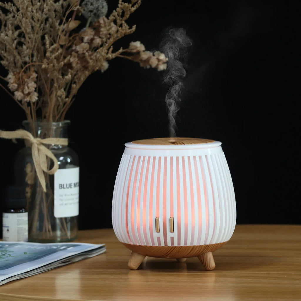 White striped aroma diffuser humidifier with warm mist and wood top