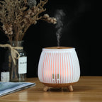 White striped aroma diffuser humidifier with warm mist and wood top