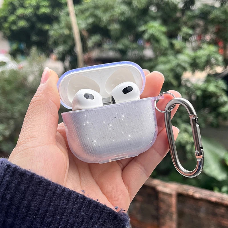Light blue AirPods case with wrist strap, open lid showing earbuds and keyring clip