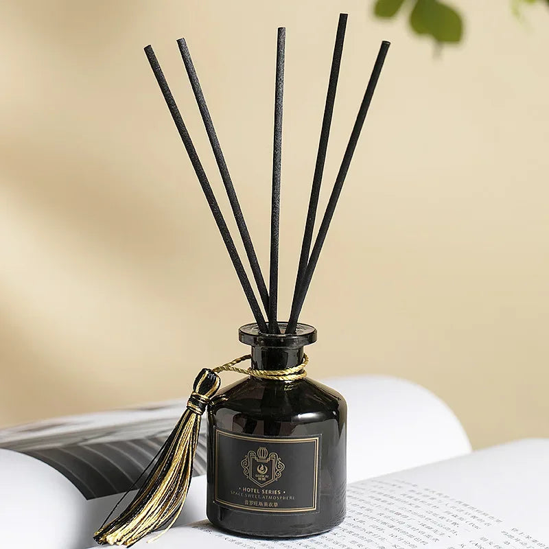 Hotel Reed Diffuser Set 50ml: dark glass bottle with black reeds and gold-tied cap