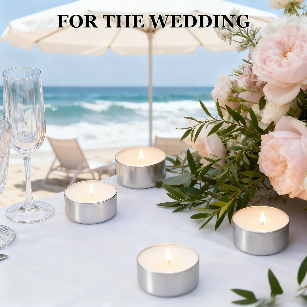 Set of silver tea light holders with lit cream-colored candles and cotton wicks