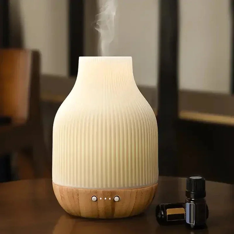 Ceramic aroma diffuser, white ribbed top with light wood base and control buttons