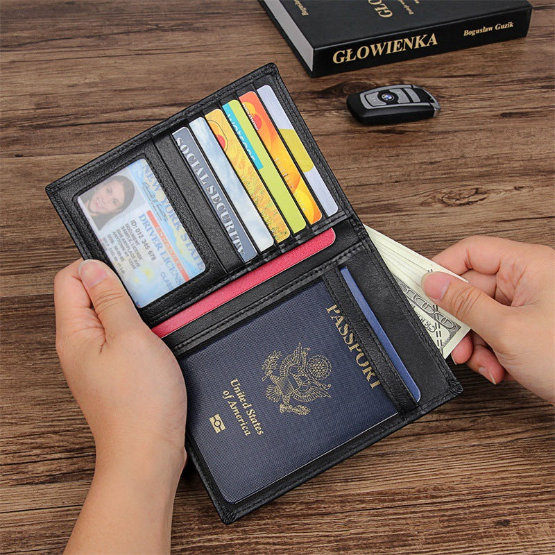 Compact travel document wallet open, showing card slots and passport sleeve on table