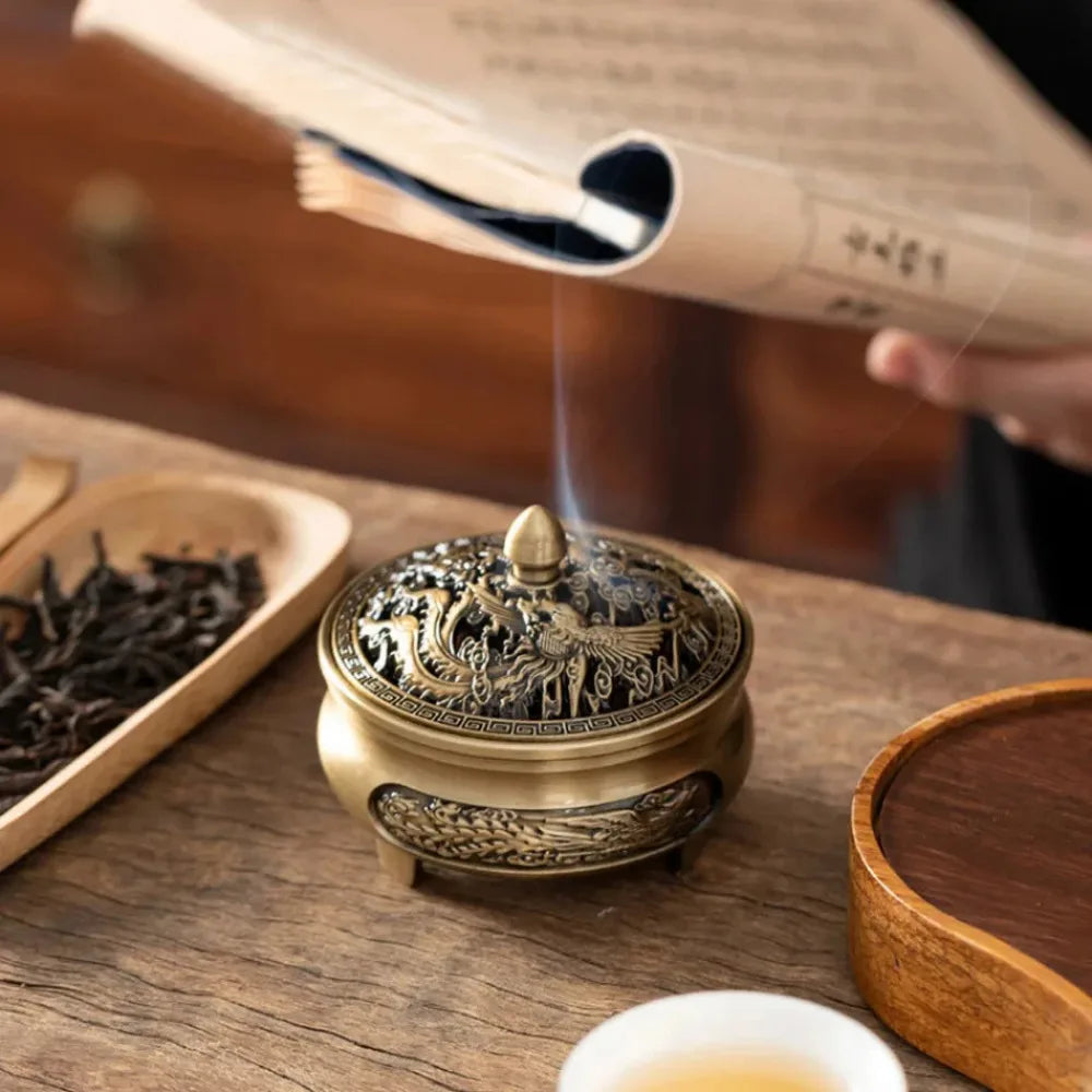 Majlis incense plate burner on a wooden base, arched opening with brass dragon panel