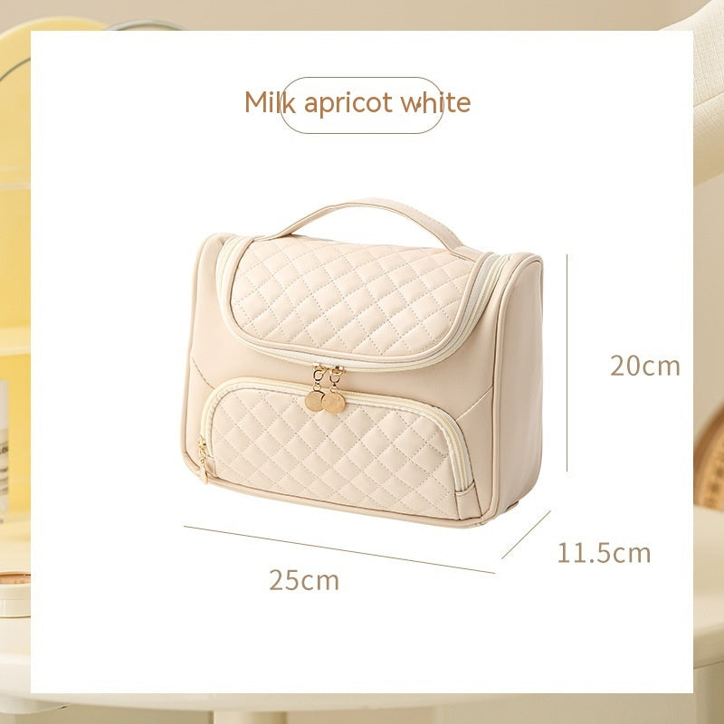 Milky white vanity bag with quilted lid and front zip pouch, compact rectangular size
