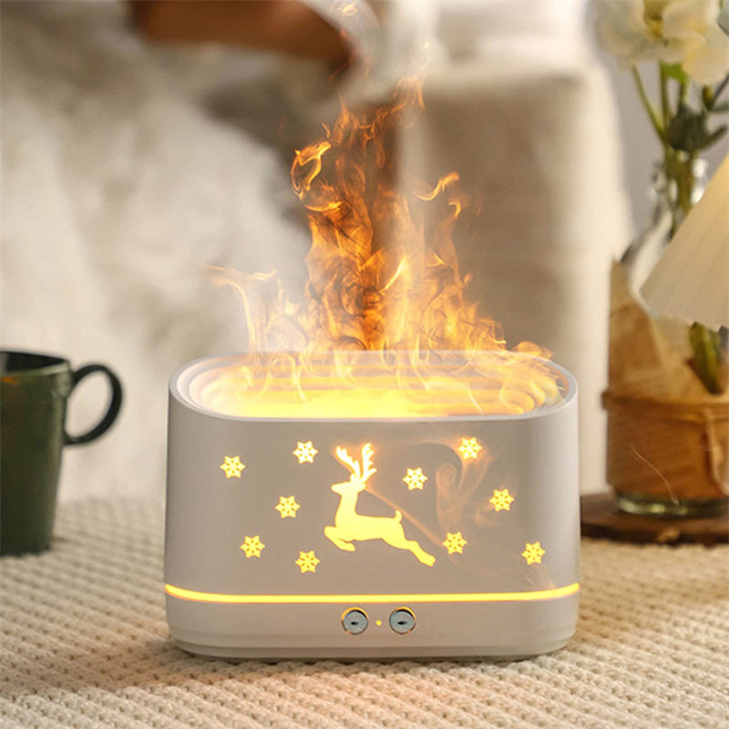 Ivory white elk diffuser with glowing top ring and deer silhouette; warm mist plume from top