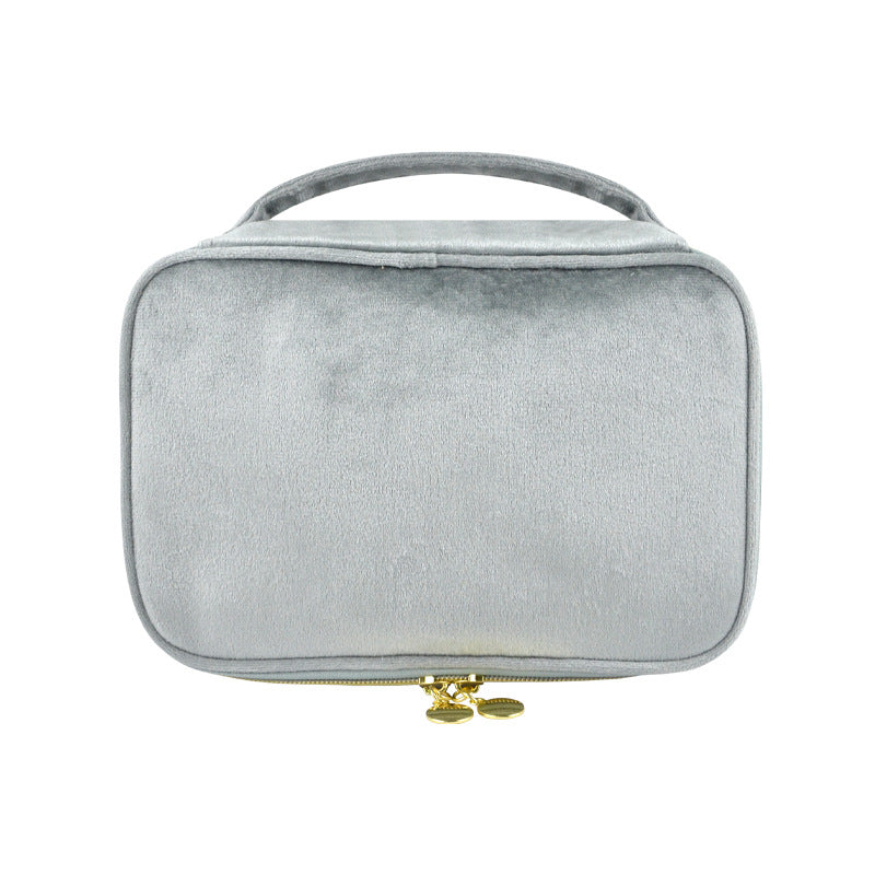 Silver gray soft travel cosmetic case with top handle and zip closure
