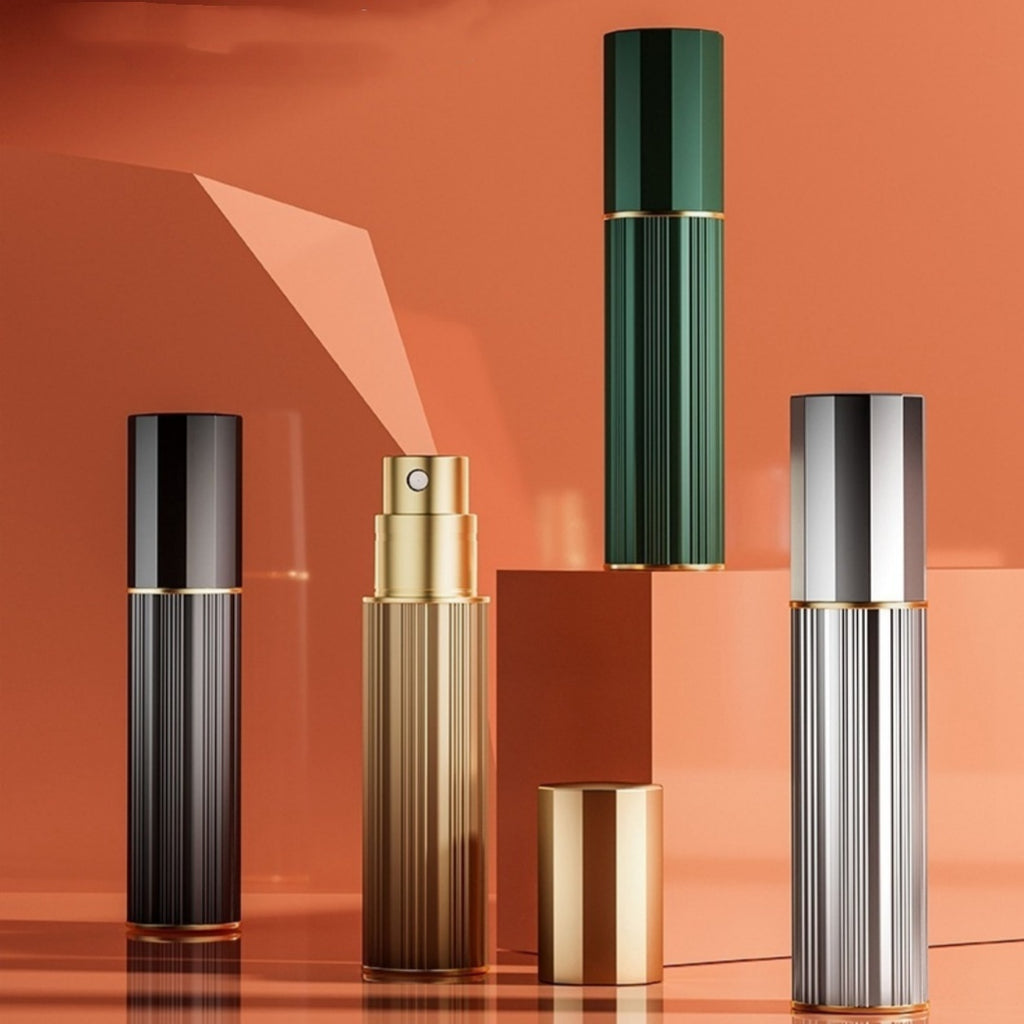 Travel perfume atomiser set of three ribbed metal sprayers with capped tops and gold rings